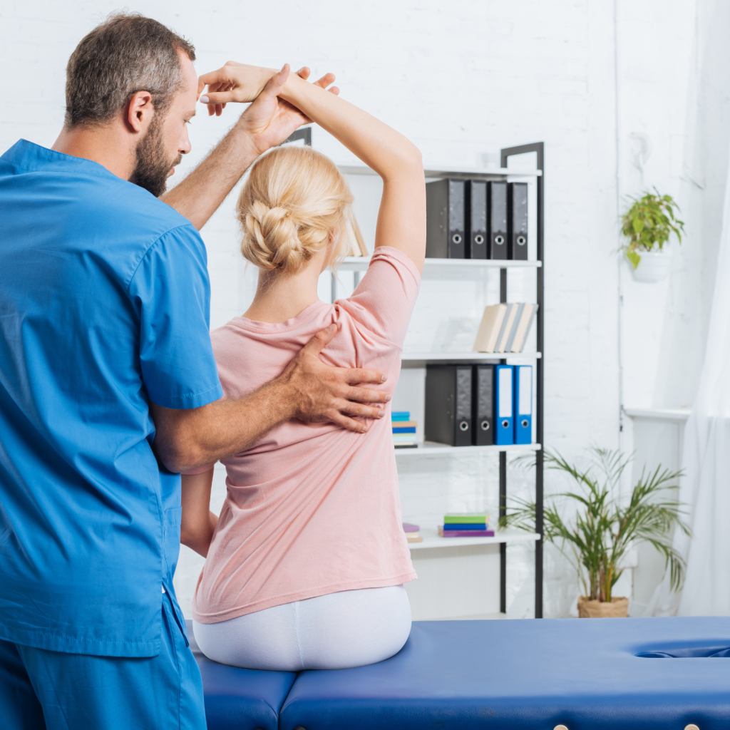 Chiropractor gently stretching a patient’s neck during treatment following a car accident.