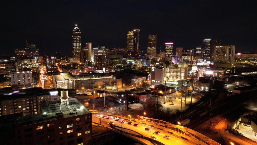 Downtown Atlanta at night showing city lights, traffic, and skyline from an elevated view
