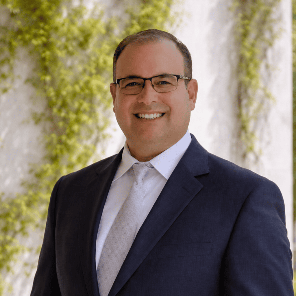 Centurion Chiropractic chiropractor smiling in a navy suit in Watkinsville, Georgia.