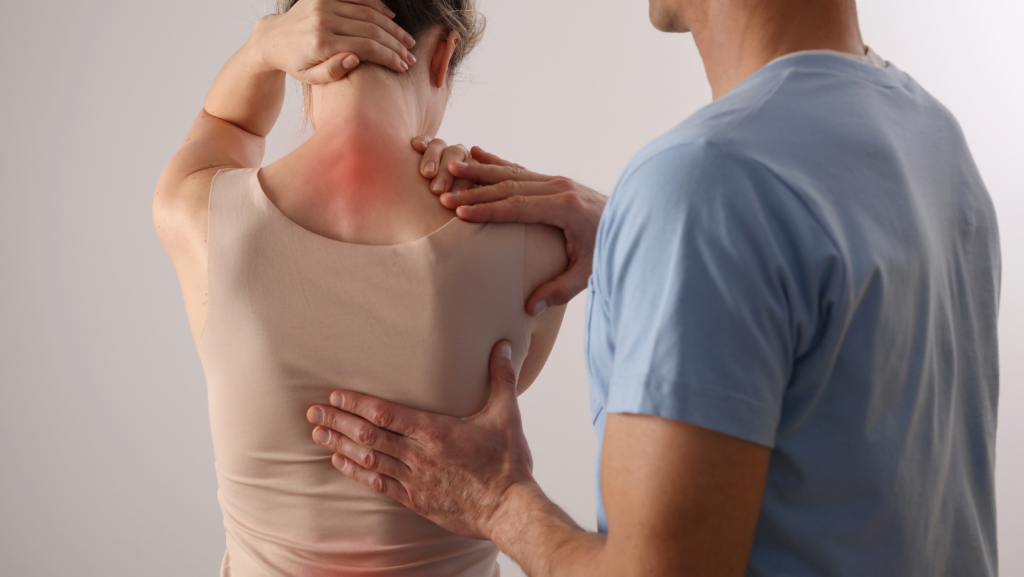 Chiropractor examining patient's neck pain after a car accident