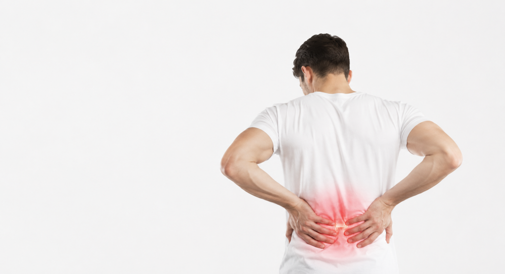 Person experiencing lower back pain after a Georgia car accident, representing common spine and disc injuries.